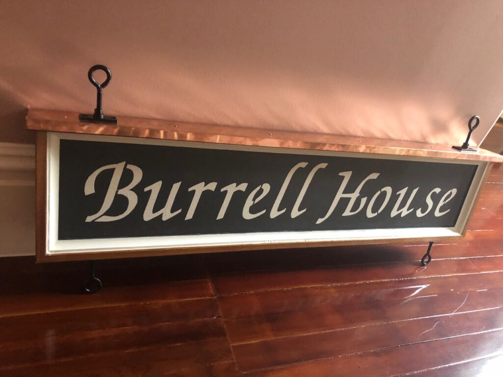 The Burrell House sign that was hand painted by the owner and operator